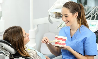 Dental assistant working with patient